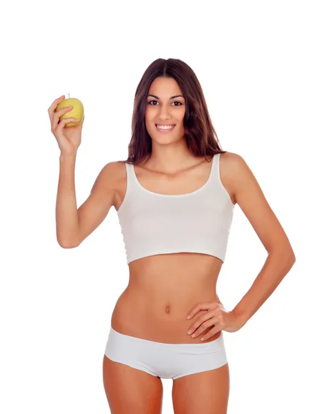 Menina em roupa interior branca com uma maçã amarela — Fotografia de Stock