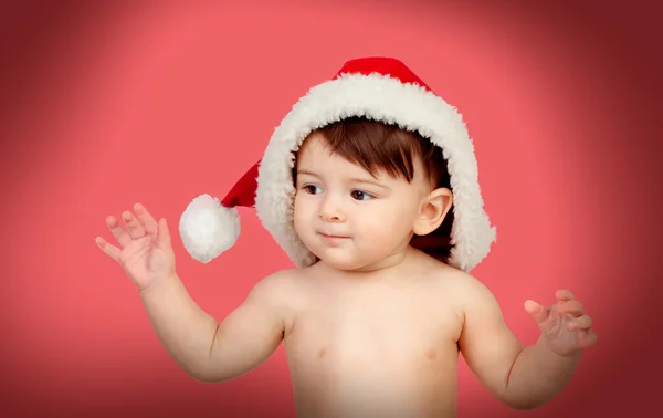 Entzückendes Baby-Mädchen mit Weihnachtsmütze — Stockfoto