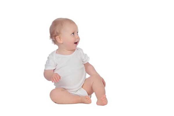 Adorable blonde baby sitting on the floor — Stock Photo, Image