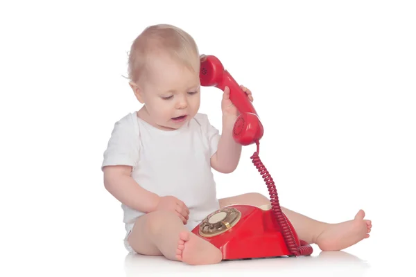 Cute caucasian baby playing with telephone — Stock Photo, Image