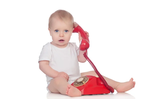 Cute caucasian baby playing with telephone — Stock Photo, Image
