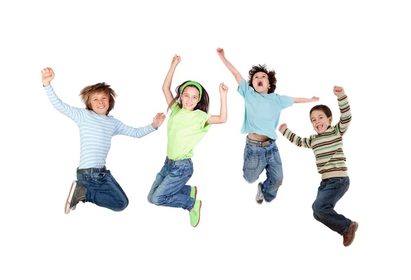 Czworo dzieci radosne, skoki — Zdjęcie stockowe