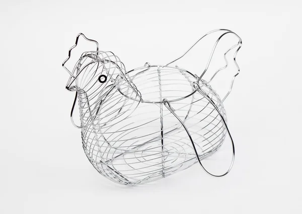 Metallic basket of eggs shaped hen empty — Stock Photo, Image