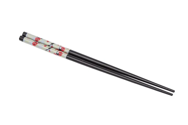 Chopsticks pretos com flores isoladas — Fotografia de Stock