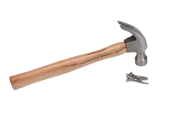 Hammer hitting a nail into a wood — Stock Photo, Image