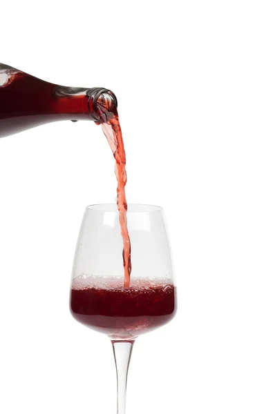 Bottle filling a glass of wine — Stock Photo, Image