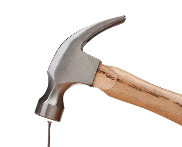 Hammer hitting a nail — Stock Photo, Image