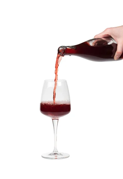 Bottle filling a glass of wine — Stock Photo, Image