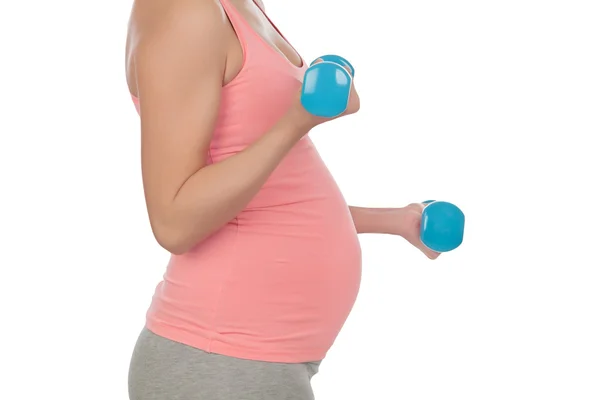 Donna incinta che fa esercizio con i manubri — Foto Stock