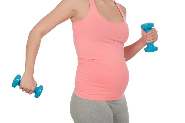 Těhotná žena, která dělá cvičení s činkami — Stock fotografie