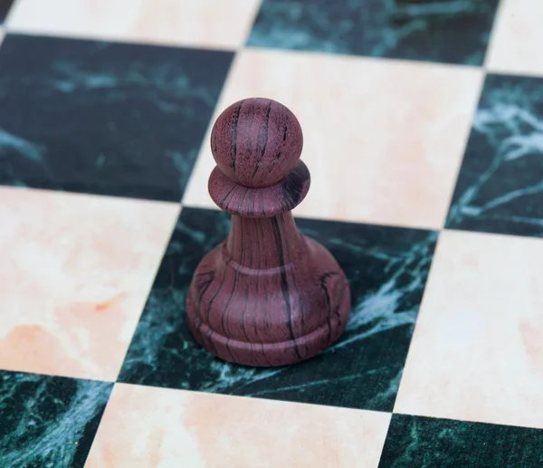 The pawn. Wooden chess piece — Stock Photo, Image