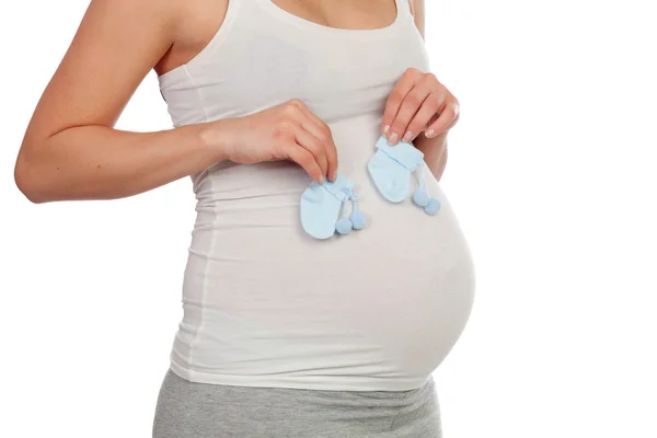 Pregnant woman with booties for her baby — Stock Photo, Image