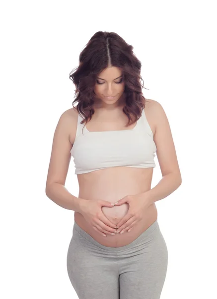 Pregnant woman forming a heart on her belly — Stock Photo, Image