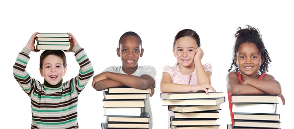 Fyra roliga barn med många böcker — Stockfoto