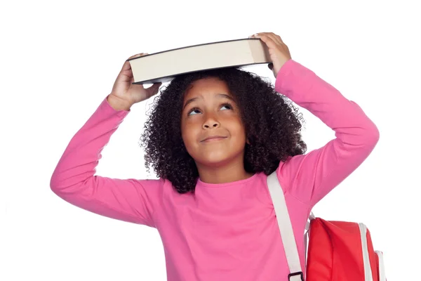 Petite étudiante avec un livre sur la tête — Photo