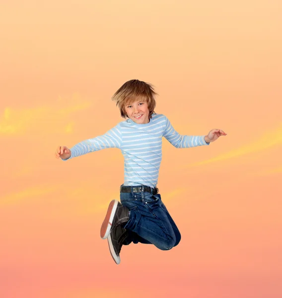 Adorable preteen boy jumping Stock Photo