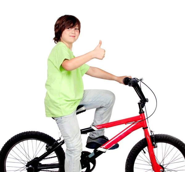 Jongen staande op een fiets — Stockfoto