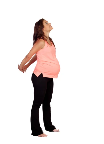 Piękna kobieta w ciąży robi rozciągania — Zdjęcie stockowe