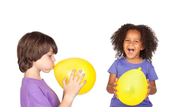Two Happy Children Blowing Yellow Balloons Isolated White Background — Stock Photo, Image