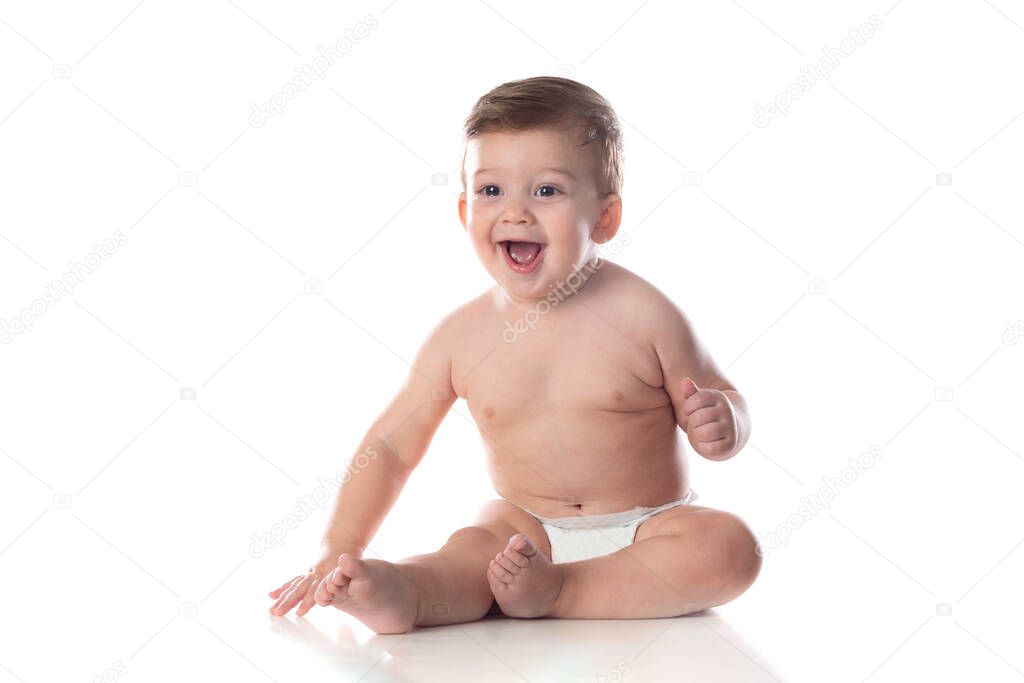 Healthy baby boy sitting on a white isolated background with space for text