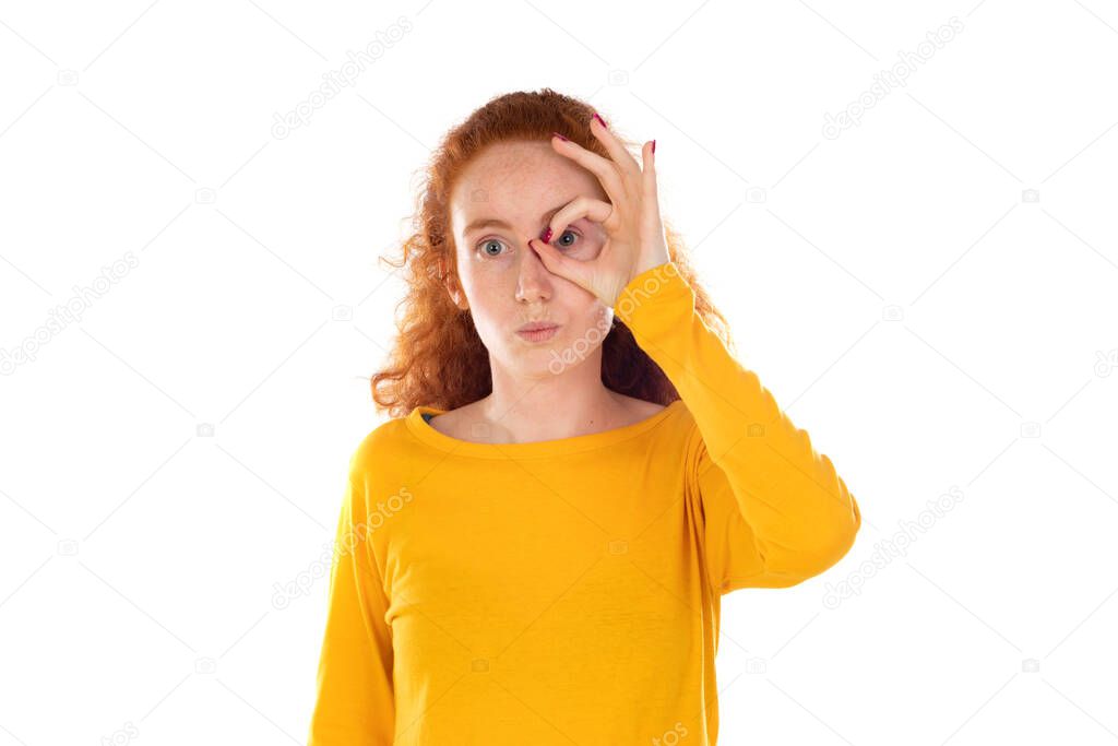 Redhead wman fooling around, making glasses hands isolated on a white background