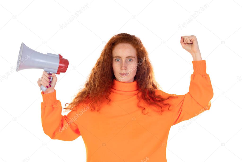 Young redhead woman girl in orange weater posing isolated on white wall background. People lifestyle concept. Scream in megaphone