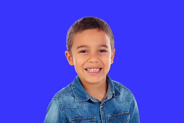 Latin Child Denim Shirt Looking Camera Laughing Isolated Blue Background — Stockfoto