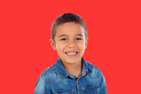 Latin Child Denim Shirt Looking Camera Laughing Isolated Red Background — 스톡 사진