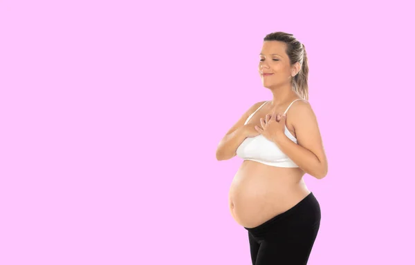 妊娠中 ピンクの背景に孤立した幸せな妊婦 — ストック写真