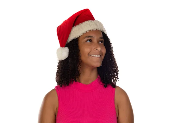 若いですアフリカ系アメリカ人の女の子身に着けていますクリスマス帽子上の隔離された背景身に着けているピンクTシャツ — ストック写真