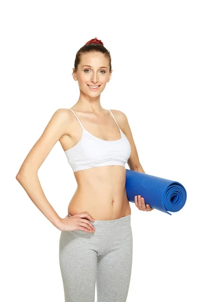 Fitnessfrau mit Matte — Stockfoto