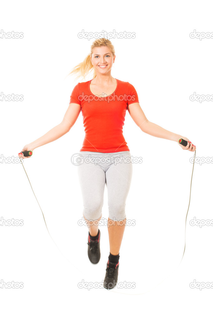 Woman exercising fitness jumping rope in