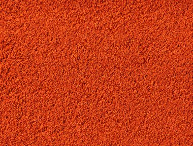 Ekranda kırmızı biber tozu var. Cayenne biberi. Paprika tozu. Yukarıdan bak. Gıda arkaplanı