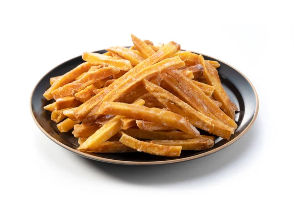 Imokempi beyaz arka plana yerleştirildi. Imokempi, tatlı patateslerden yapılmış ve şekerle kaplanmış bir Japon tatlısıdır..