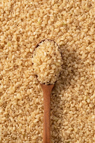 Brown Rice Wooden Spoon Laid Out Screen Food Background Composition — Stock Photo, Image