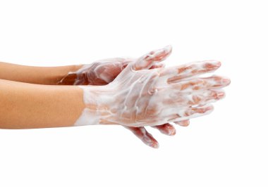 Female hand washing hands with soap lather on white background. Hands with white foam. Texture of white soap foam on female hand.