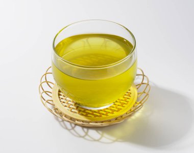 Cold Japanese green tea set against a white background. 