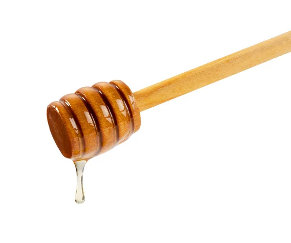 白い背景に蜂蜜と木の蜂蜜のディップ 蜂蜜のディップから滴り落ちる — ストック写真