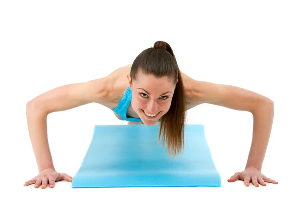 Young fit woman doing push ups. — Stock Photo, Image