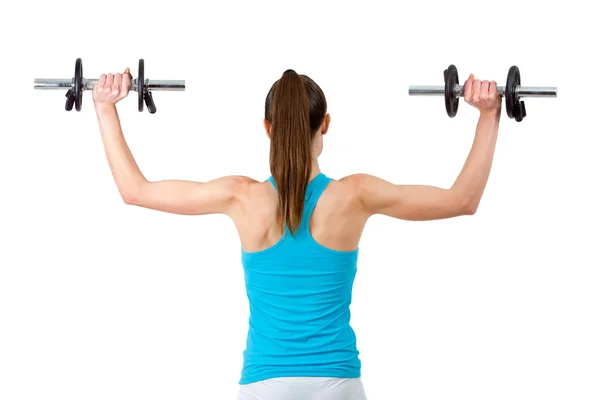 Rear view of woman lifting weights. — Stock Photo, Image