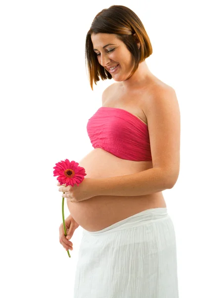 Portret kobiety w ciąży z kwiatem. — Zdjęcie stockowe