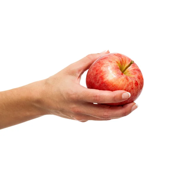 Mano femminile tenuta mela rossa . — Foto Stock