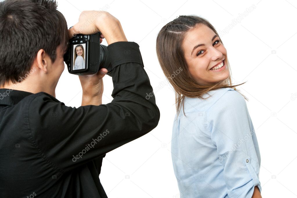 Cute girl posing in front of photographer.