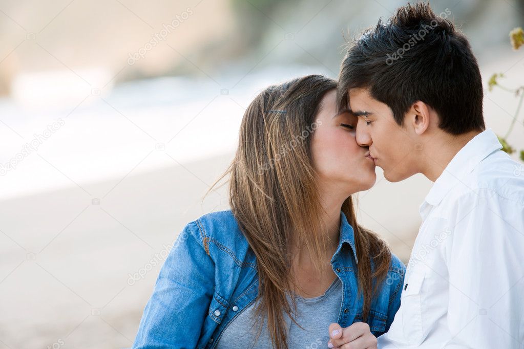 Romantic kiss on beach.