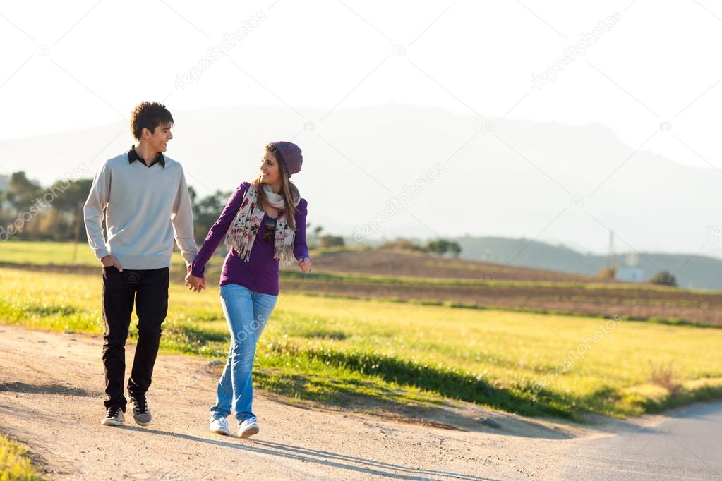 Young couple having a walk in countryside.