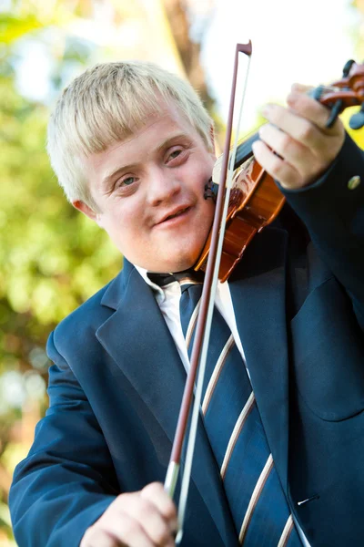 Cute handicapped boy playing violin. — Stock Photo, Image