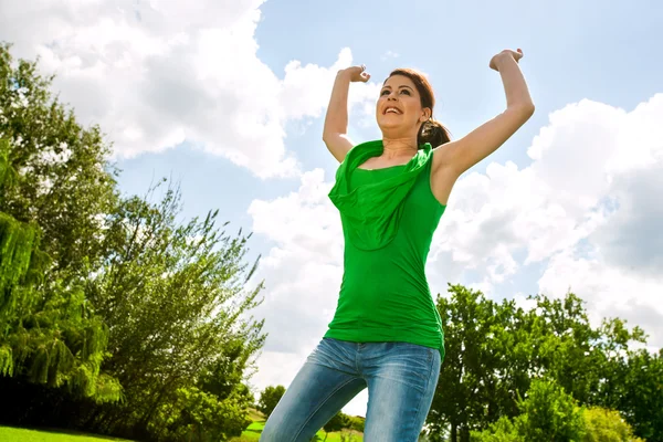 Happy girl jumping outdoors. — Stock Photo, Image