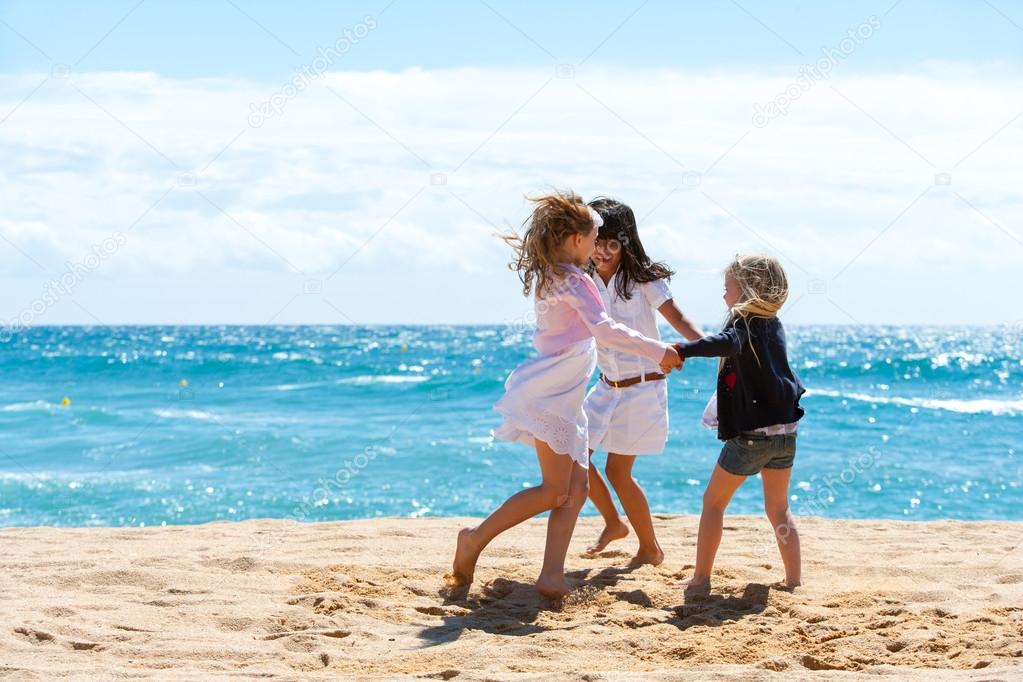 Children playing game on beach.