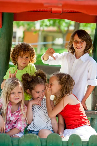 Girls keeping secrets from boys. — Stock Photo, Image