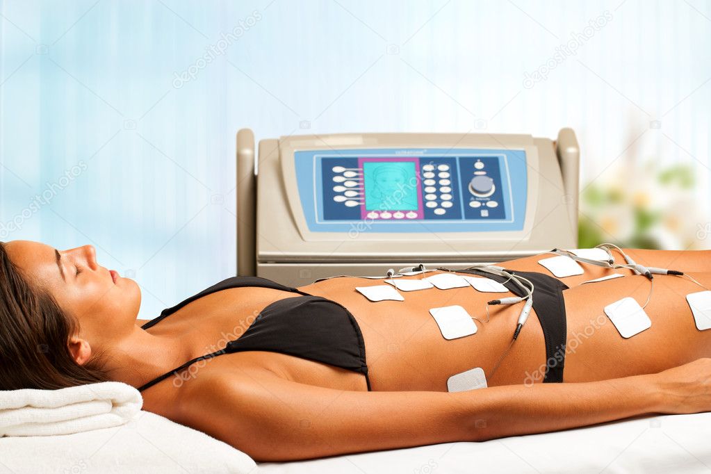 Woman having electrical lymphatic drainage.